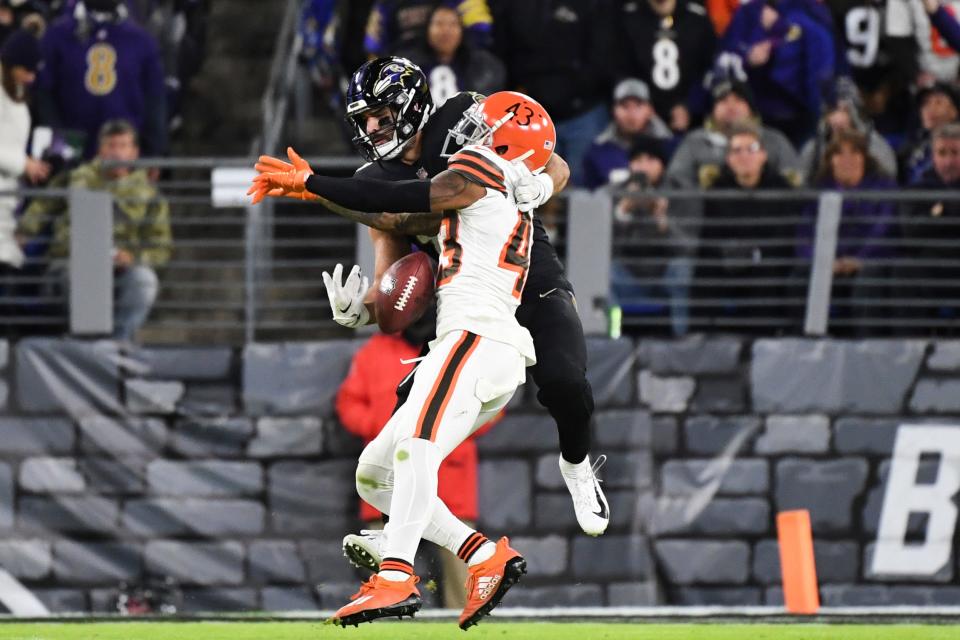 Cleveland Browns safety John Johnson III (43) intercepts the ball against Baltimore Ravens tight end Mark Andrews during the fourth quarter of an NFL football game, Sunday, Nov. 28, 2021, in Baltimore. (AP Photo/Terrance Williams)