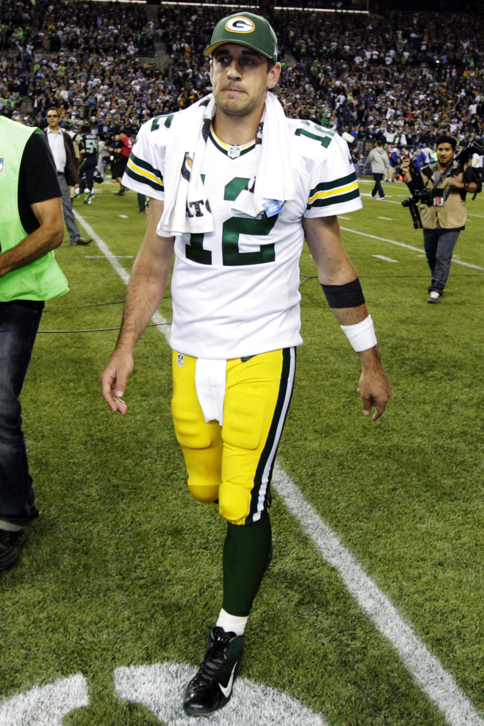 Green Bay Packers quarterback Aaron Rodgers walks off the field after the Seattle Seahawks defeated the Packers 14-12 in an NFL football game, Monday, Sept. 24, 2012, in Seattle. (AP Photo/Ted S. Warren)