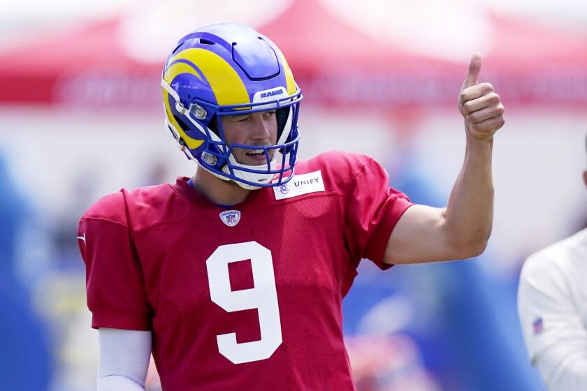 Los Angeles Rams quarterback Matthew Stafford gestures during an NFL football practice in Irvine