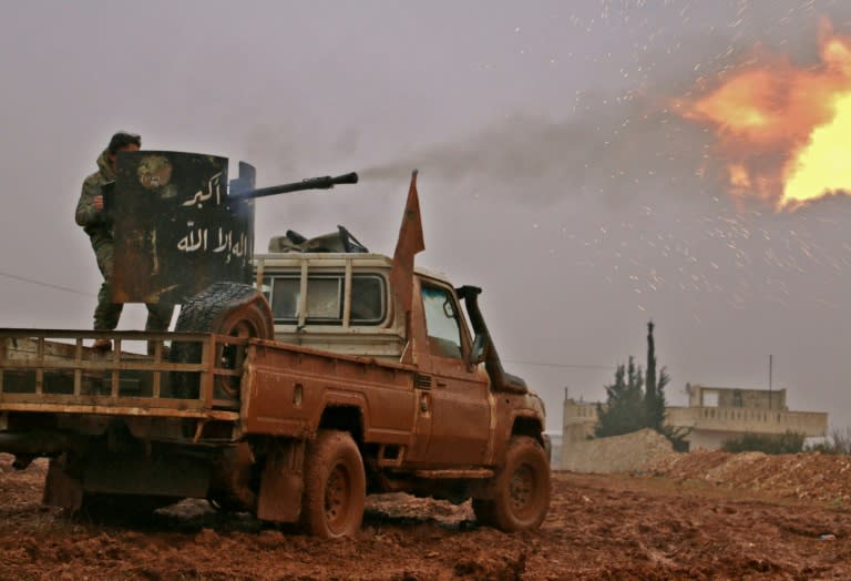 Syrian opposition fighters fire towards positions held by Islamic State (IS) group jihadists in al-Bab on December 13, 2016