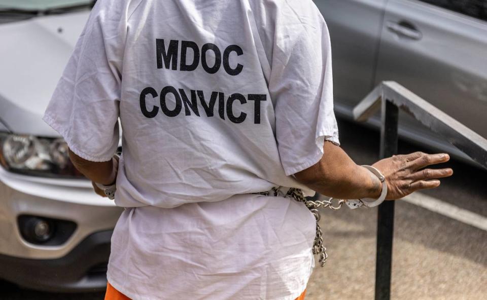 A woman going through the civil commitment process, wearing a shirt labeling her a “convict,” is transported from her commitment hearing back to a county jail to await transportation to a state hospital in north Mississippi this spring. Eric J. Shelton/Mississippi Today