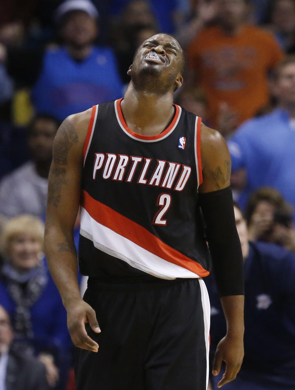 Portland Trail Blazers guard Wesley Matthews (2) grimaces after being fouled in the fourth quarter of an NBA basketball game against the Oklahoma City Thunder in Oklahoma City, Tuesday, Jan. 21, 2014. Oklahoma City won 105-97. (AP Photo/Sue Ogrocki)