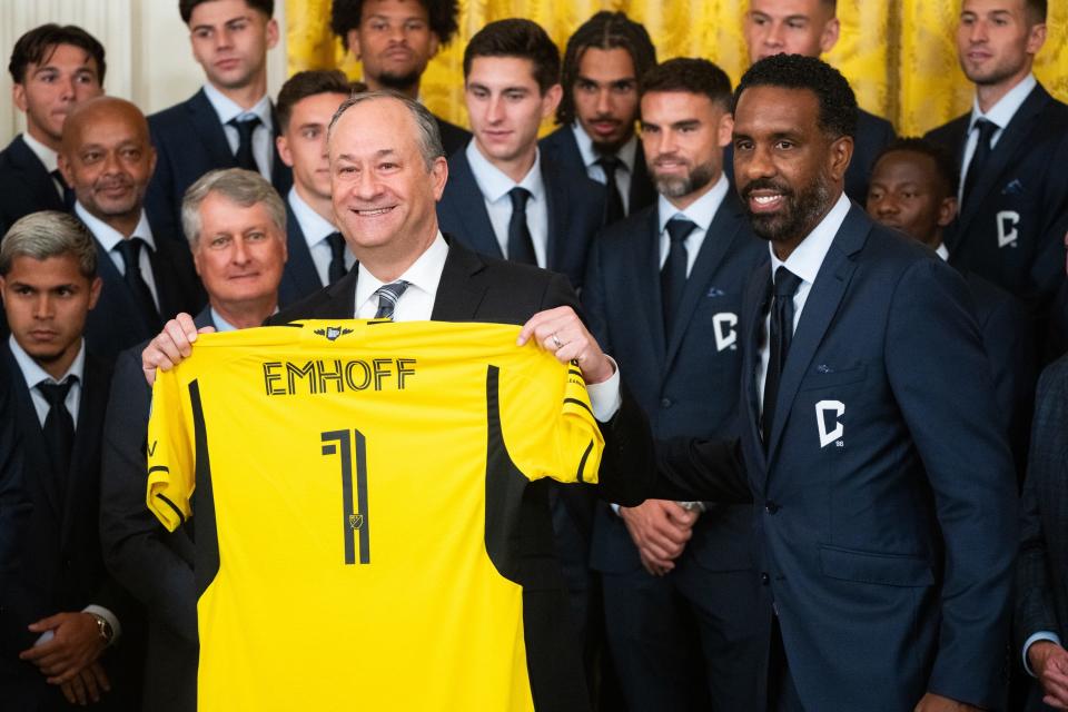 Sep 27, 2024; Washington, DC, USA; Second Gentleman Doug Emhoff shows off his commemorative jersey from the Columbus Crew during their visit to the White House to celebrate their Major League Soccer Cup in 2023. The MLS team visited with President Joe Biden and Second Gentleman Doug Emhoff. Mandatory Credit: Josh Morgan/USA TODAY NETWORK via Imagn Images