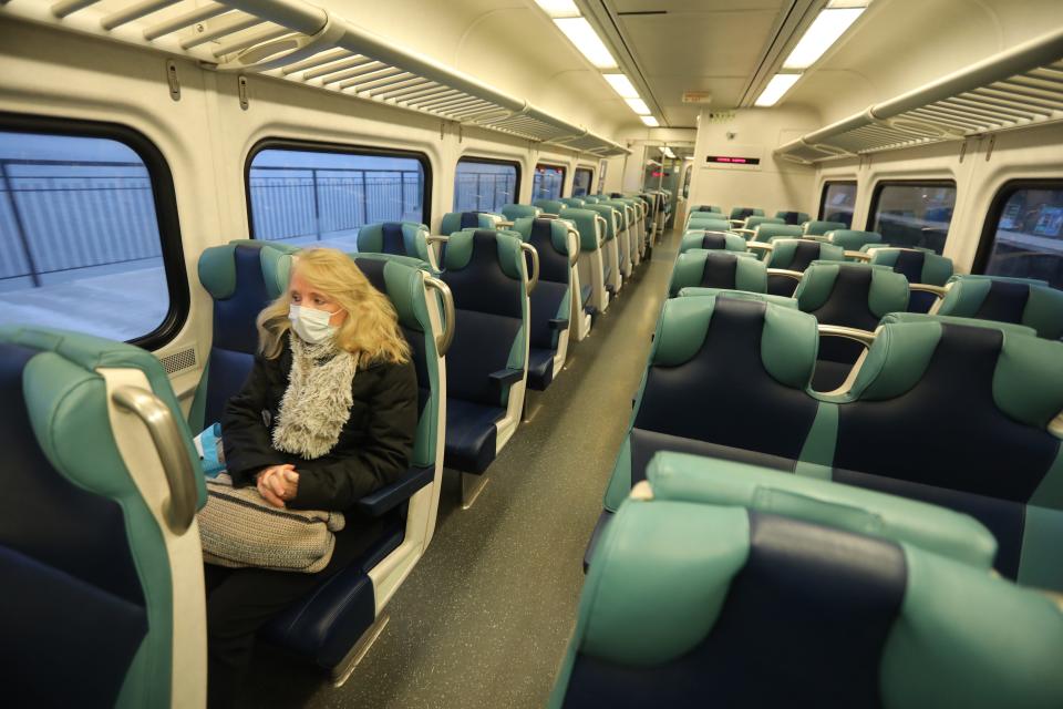 Lori Glazer of Ossining, N.Y., rides the empty local 7:14 a.m. Metro-North train in to New York City during what would typically be morning rush hour on March 25. Glazer is a registered nurse in the Children's Hospital at New York-Presbyterian/Columbia University Medical Center.