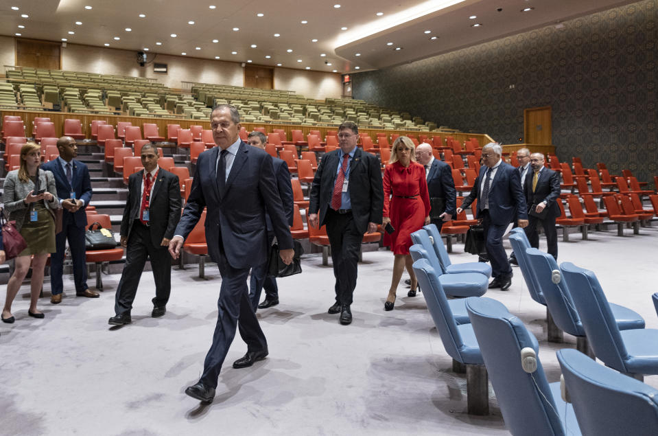 Russian Foreign Minister Sergey Lavrov, center left, walks through Security Council chambers on his way to meet with U.S. Secretary of State Mike Pompeo during the 74th session of the United Nations General Assembly, at U.N. headquarters, Friday, Sept. 27, 2019. (AP Photo/Craig Ruttle)