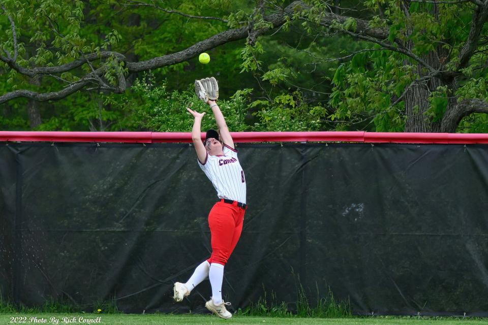 Corning Community College's Emma Loomis leaps for a fly ball during an 11-2 win over Niagara County Community College in an NJCAA regional final May 20, 2022 in Corning.