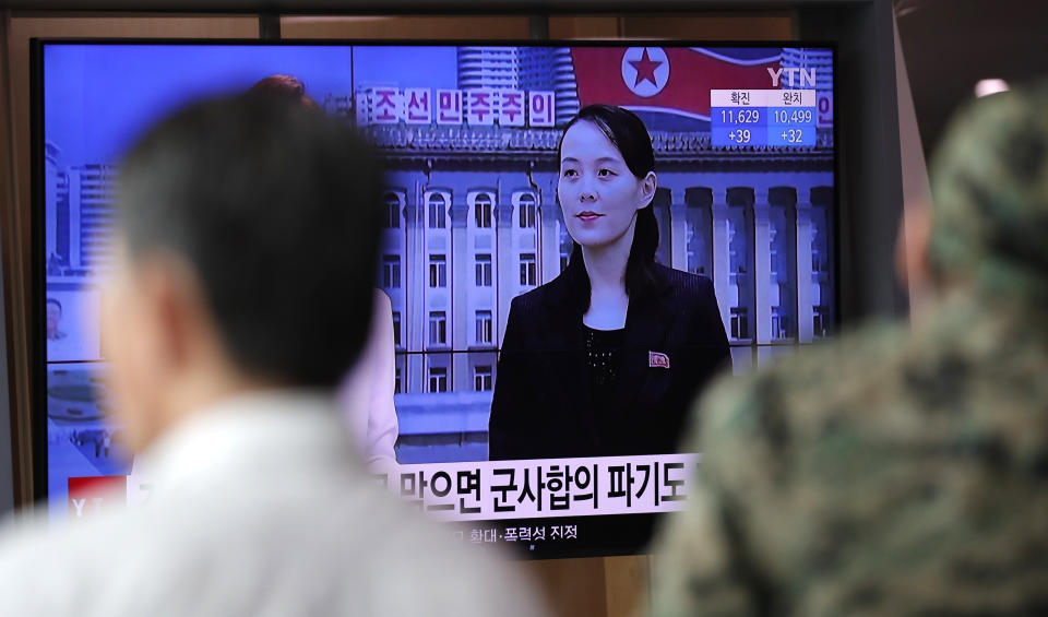 A man watches a TV screen showing a news program with a file image of Kim Yo Jong, the powerful sister of North Korea's leader Kim Jong Un, at the Seoul Railway Station in Seoul, South Korea, Thursday, June 4, 2020. North Korea threatened on Thursday to end an inter-Korean military agreement reached in 2018 to reduce tensions if the South fails to prevent activists from flying anti-Pyongyang leaflets over the border. The part of letters read " Military agreement." (AP Photo/Lee Jin-man)