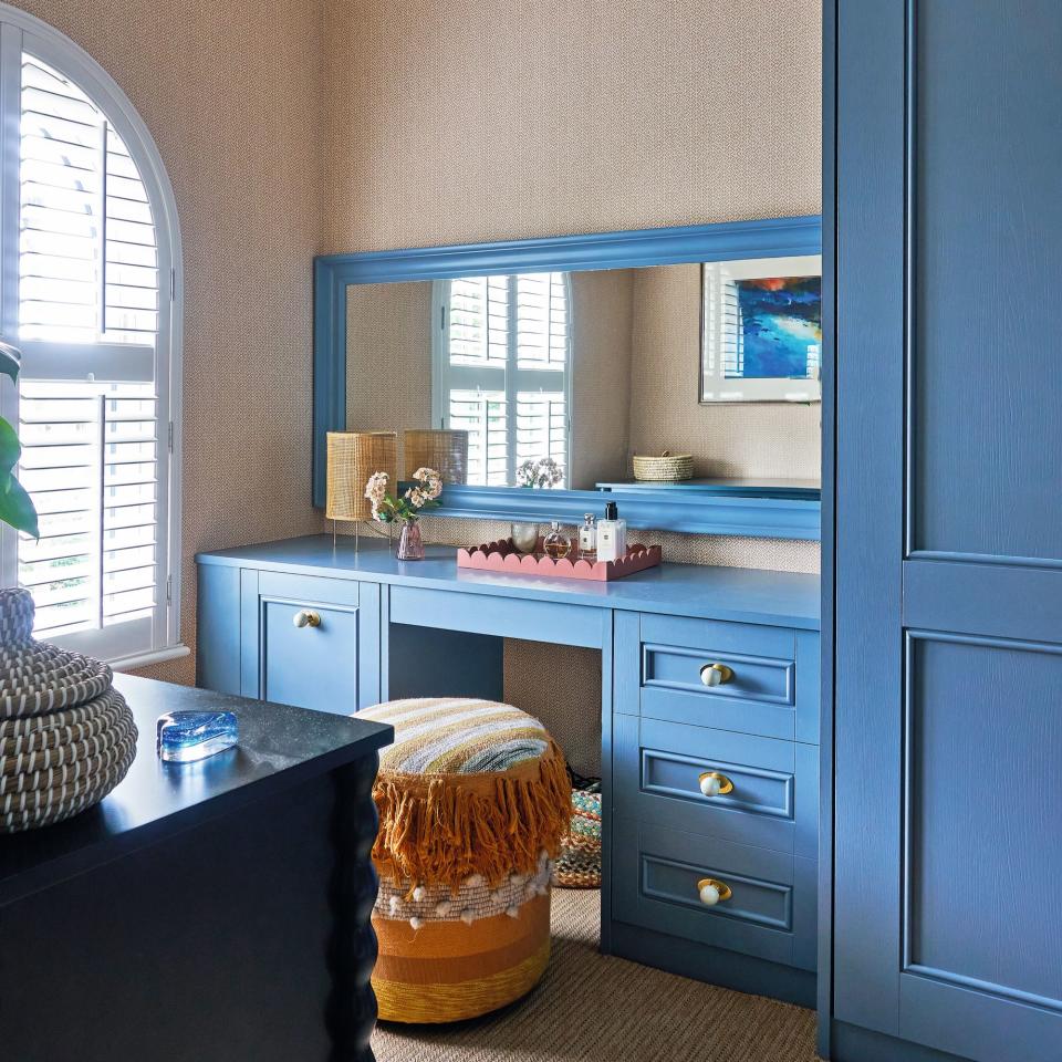 blue wardrobe and chairs with yellow stool