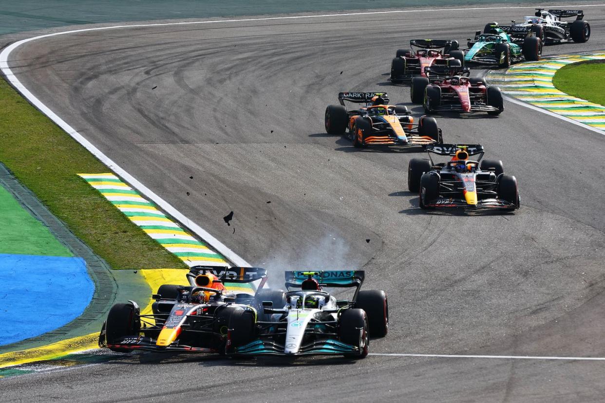 sao paulo, brazil   november 13 max verstappen of the netherlands driving the 1 oracle red bull racing rb18 and lewis hamilton of great britain driving the 44 mercedes amg petronas f1 team w13 collide during the f1 grand prix of brazil at autodromo jose carlos pace on november 13, 2022 in sao paulo, brazil photo by mark thompsongetty images