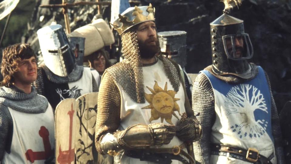 King Arthur and his knights stand in their armor in Monty Python and the Holy Grail