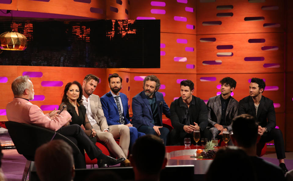 (left to right) Host Graham Norton, Gloria Estefan, Chris Hemsworth, David Tennant and Michael Sheen, Nick Jonas, Joe Jonas, and Kevin Jonas of the Jonas Brothers during the filming for the Graham Norton Show at BBC Studioworks 6 Television Centre, Wood Lane, London, to be aired on BBC One on Friday evening.