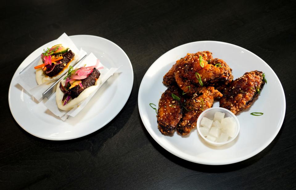 The short rib buns, left, and Korean fried chicken from Stick and Buns on Thursday, Oct. 26, 2023, at The Galley on the Levee in Newport, Ky. The food hall opens to the public on Saturday, Oct. 28, 2023.