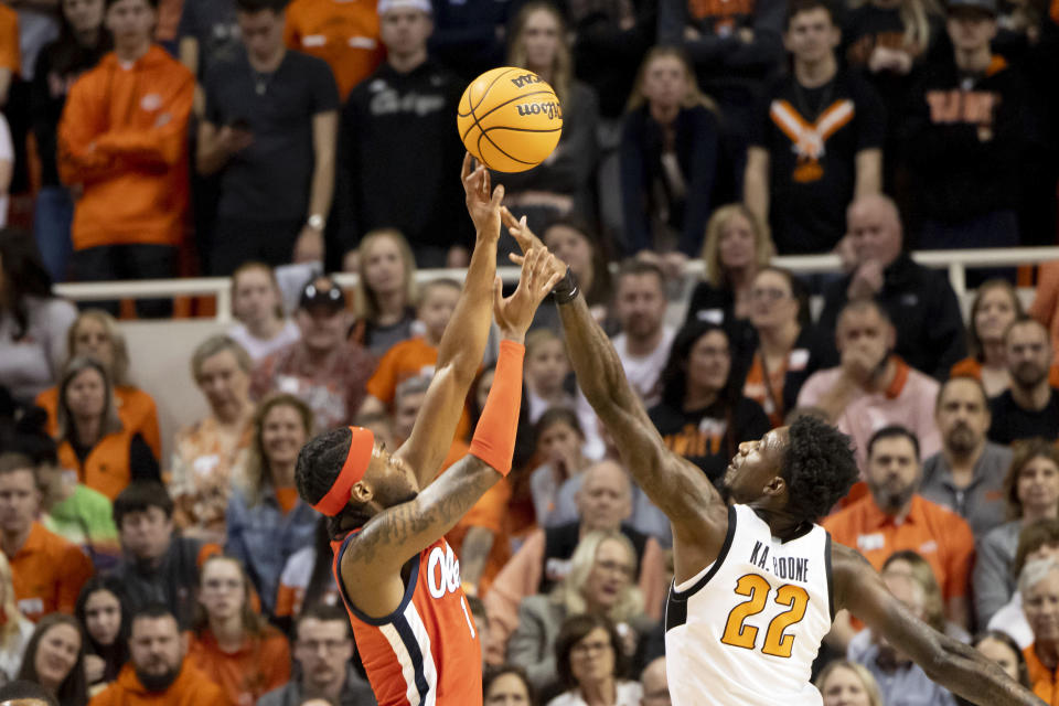 Mississippi's Amaree Abram (1) shoots over Oklahoma State's Kalib Boone (22) during the first half of an NCAA college basketball game in Stillwater, Okla., Saturday, Jan. 28, 2023. (AP Photo/Mitch Alcala)