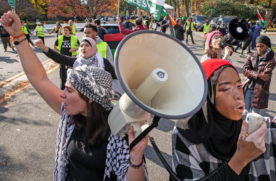 From front left, Lead Organizer Yara Awad and Delaware State Rep Madinah Wilson-Anton; and back left Palestinian Political Activist Linda Sarsour and Lead Organizer Dounya Ramadan rally the crowd at the entrance to the driveway of President Biden's home during a Rally in Support of Palestine in Greenville, Saturday, Nov. 11, 2023. Close to 2,000 participants attended the rally which culminated with a march to the President's home, where the secret service, state and local police guarded the entrance.