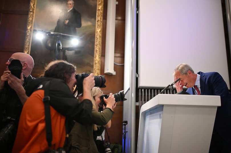 Nigel Farage, Reform UK leader and new MP for Clacton, reacts as a protester interrupts his presentation of the programme