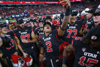 Utah running back Micah Bernard (2) celebrates with teammates after the team's 38-10 win over Oregon to win the Pac-12 Conference championship NCAA college football game Friday, Dec. 3, 2021, in Las Vegas. (AP Photo/Chase Stevens)