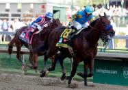 May 2, 2015; Louisville, KY, USA; Victor Espinoza aboard American Pharoah wins the 141st Kentucky Derby at Churchill Downs. Mandatory Credit: Peter Casey-USA TODAY Sports