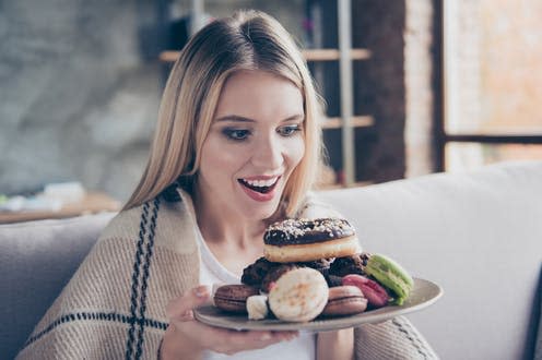 <span class="caption">Our “food reward” system can seriously undermine our ability to resist temptation.</span> <span class="attribution"><a class="link " href="https://www.shutterstock.com/image-photo/diet-finished-wow-yumyum-beautiful-excited-769003771" rel="nofollow noopener" target="_blank" data-ylk="slk:Roman Samborskyi/ Shutterstock;elm:context_link;itc:0;sec:content-canvas">Roman Samborskyi/ Shutterstock</a></span>