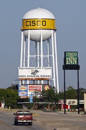 A billboard urging consideration of biblical values when voting is displayed below a water tower in Cisco, Texas August 23, 2015. REUTERS/Mike Stone