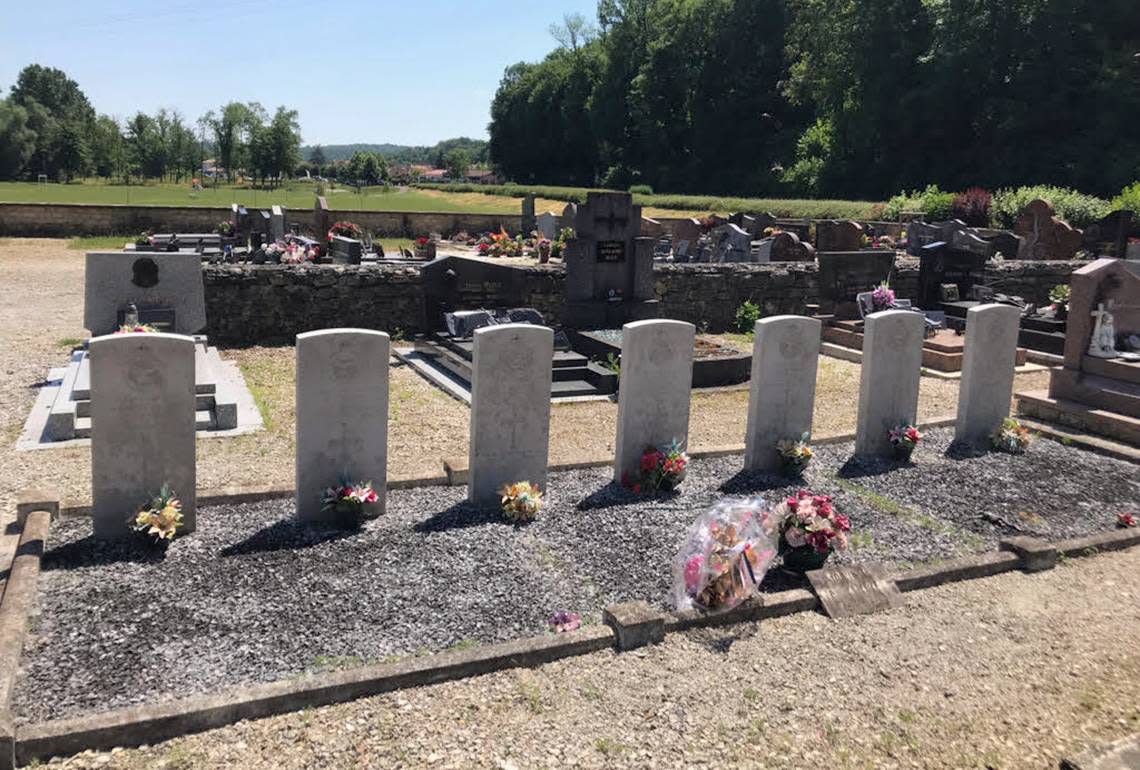 Gravestones mark the resting places of six British and one Australian airmen who averted disaster at Laneuville-à-Bayard, France, during World War II.