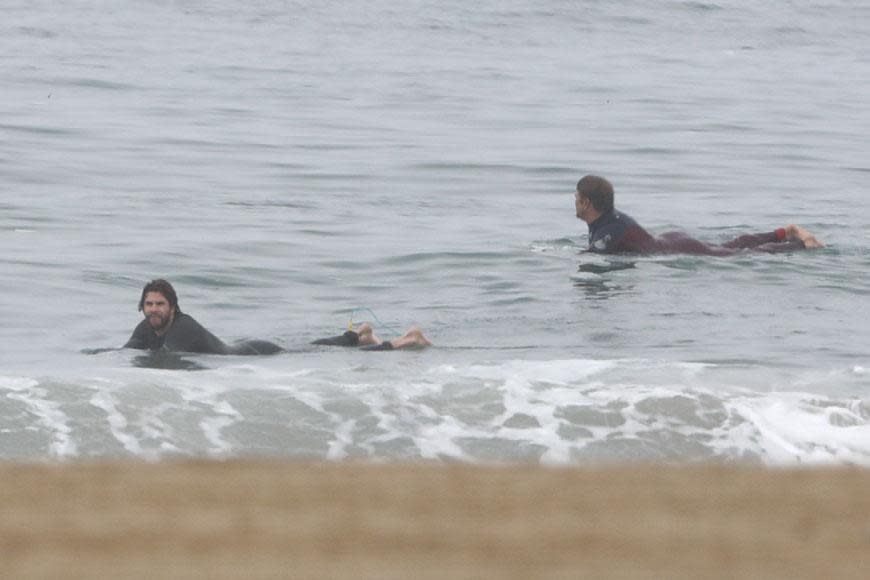 Liam Hemsworth strips off at the beach