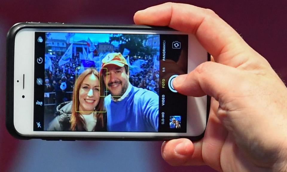 Matteo Salvini takes a selfie with candidate Lucia Borgonzoni during a campaign rally on Saturday.