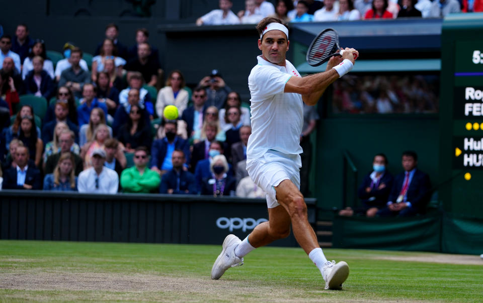 Roger Federer of Switzerland plays a backhand during his men's Singles Quarter Final match against Hubert Hurkacz of Poland on Day Nine of The Championships - Wimbledon 2021 at All England Lawn Tennis and Croquet Club on July 07, 2021 in London, England. 