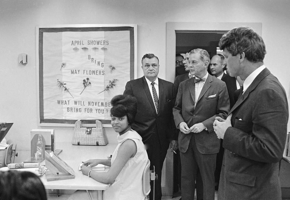 <p>Sen. Robert Kennedy, far left, tours the Manpower Development and Training Center at Greenville, Miss., April 12, 1967. (Photo: Jack Thornell/AP) </p>