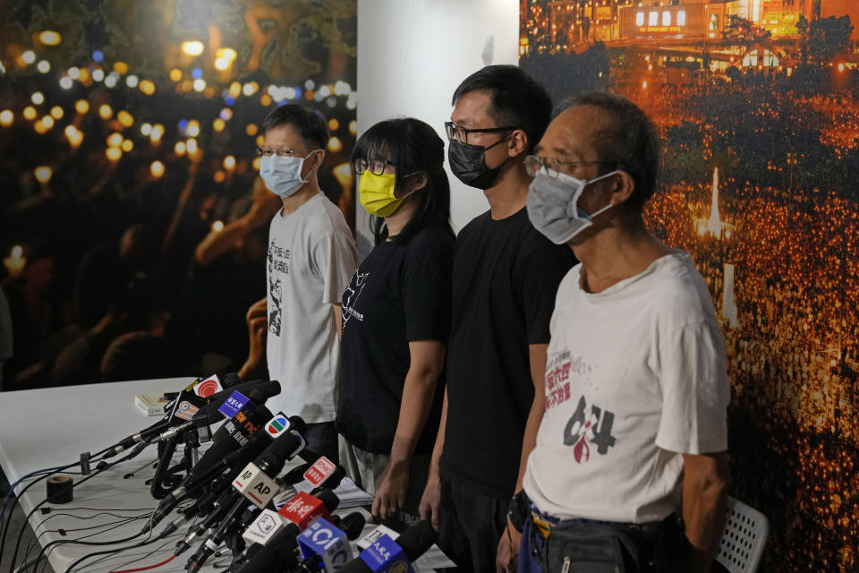 Chow Han Tung, vice chairwoman of the Hong Kong Alliance in Support of Patriotic Democratic Movements of China, second left, and other group members attend a news conference in Hong Kong, Sunday, Sept. 5, 2021. The group behind the annual Tiananmen Square memorial vigil in Hong Kong said Sunday it will not cooperate with police conducting a national security investigation into the group's activities, calling it an abuse of power. (AP Photo/Kin Cheung)