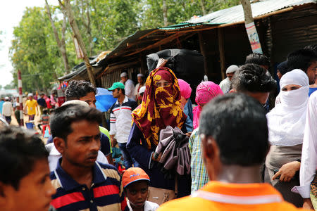 Formin Akter, a Rohingya refugee girl, waits for a tuk-tuk as she heads to Chittagong to attend school at the Asian University for Women, in Cox's Bazar, Bangladesh, August 24, 2018. Picture taken August 24, 2018. REUTERS/Mohammad Ponir Hossain