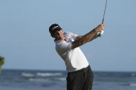 Brendan Steele follows his drive off the 17th tee during the third round at the Sony Open golf tournament Saturday, Jan. 16, 2021, in Honolulu. (AP Photo/Marco Garcia)