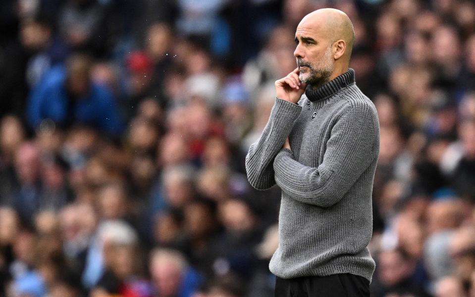Manchester City's Spanish manager Pep Guardiola reacts during the English Premier League football match between Manchester City and Brighton and Hove Albion at the Etihad Stadium in Manchester, north west England, on October 21, 2023.
