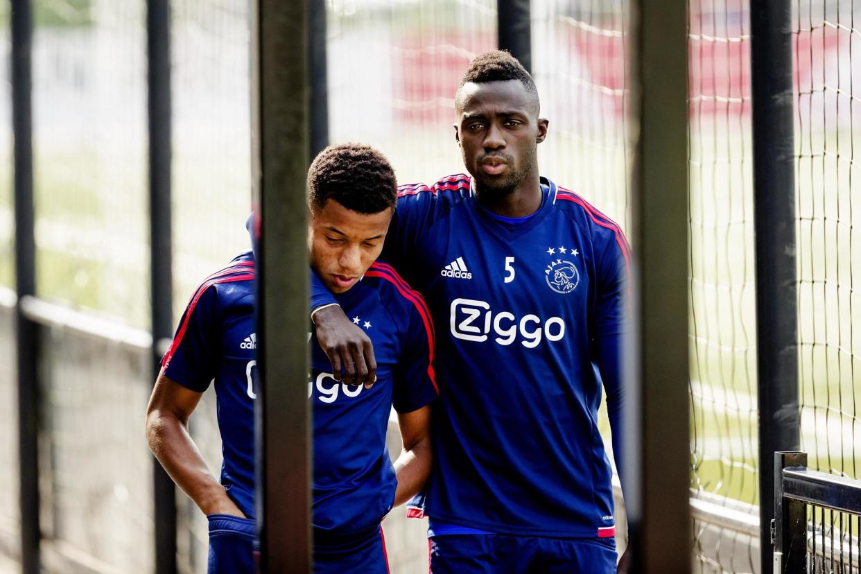 Ajax's Davinson Sanchez (R) and David Neres before training on Wednesday August 16: Robin van Lonkhuijsen/AFP/Getty Images