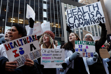 Demonstrators that include mostly medical students protest a proposed repeal of the Affordable Care Act in New York, U.S., January 30, 2017. REUTERS/Lucas Jackson