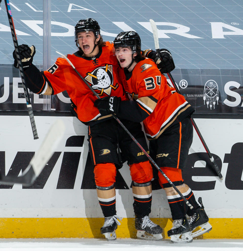 ANAHEIM, CA - MARCH 18: Trevor Zegras #46 of the Anaheim Ducks celebrates his second-period goal against the Arizona Coyotes, his first NHL career goal, with Jamie Drysdale #34 during the game at Honda Center on March 18, 2021 in Anaheim, California.  Drysdale was playing in his NHL debut game. (Photo by Debora Robinson/NHLI via Getty Images)