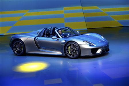 Porsche CEO, Matthias Mueller presents the new Porsche 918 Spyder hybrid car at the Volkswagen group night at the Frankfurt motor show September 9, 2013. REUTERS/Ralph Orlowski