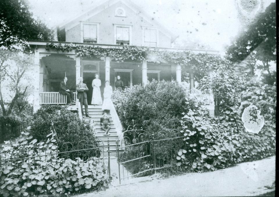 Thomas Wolfe was born in the house his father, W.O., built on Woodfin Street, where the YMCA now sits. That's the future novelist, lowest on the steps.