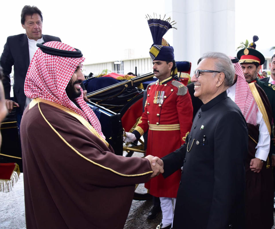 In this photo released by the Press Information Department, Pakistani President Arif Alvi, right, receives visiting Saudi Arabia's Crown Prince Mohammed bin Salman at presidential palace in Islamabad, Pakistan, Monday, Feb. 18, 2019. A senior Saudi diplomat on Monday assailed Iran for initially blaming the kingdom for last week's attack that killed 27 members of Iran's elite Revolutionary Guard. (Press Information Department, via AP)