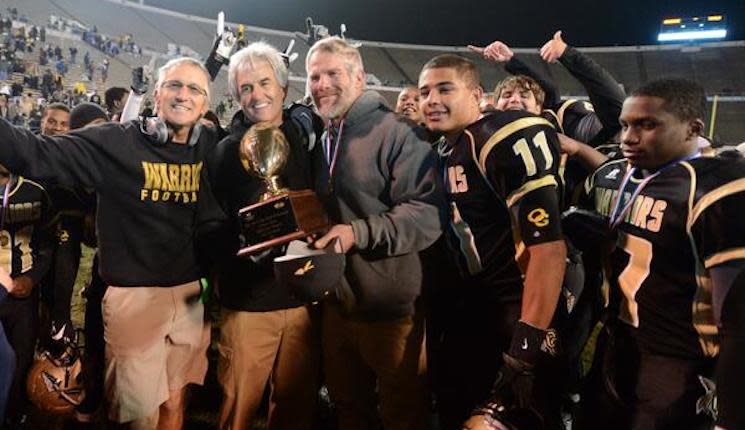Brett Favre and Oak Grove head coach Nevil Barr hold the Class 6A state trophy — Twitter