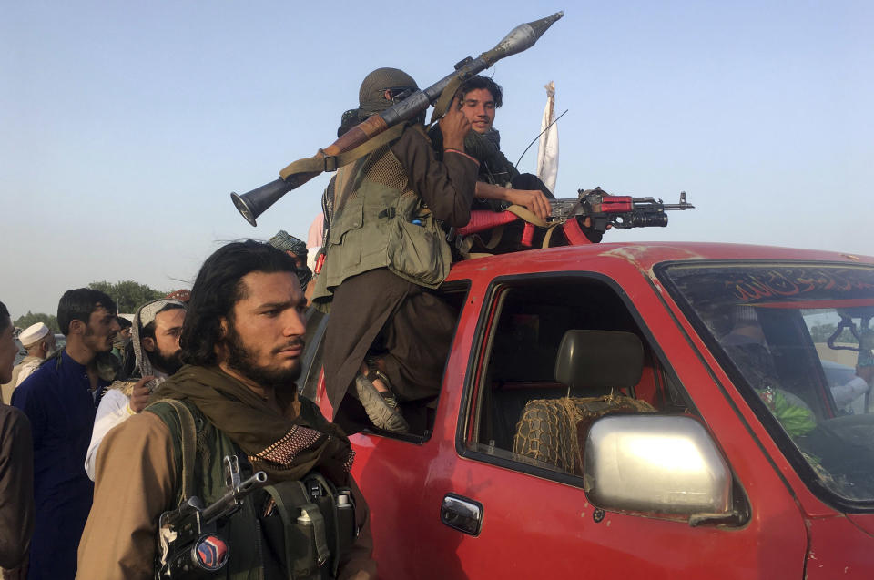 Image: Taliban fighters (Raumat Gul / AP file)
