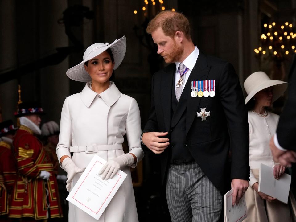 prince harry and meghan markle attending a service celebrating queen elizabeth's platinum jubilee