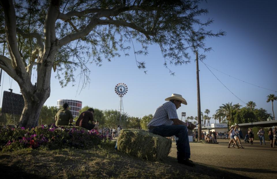 A man sits down underneath a tree