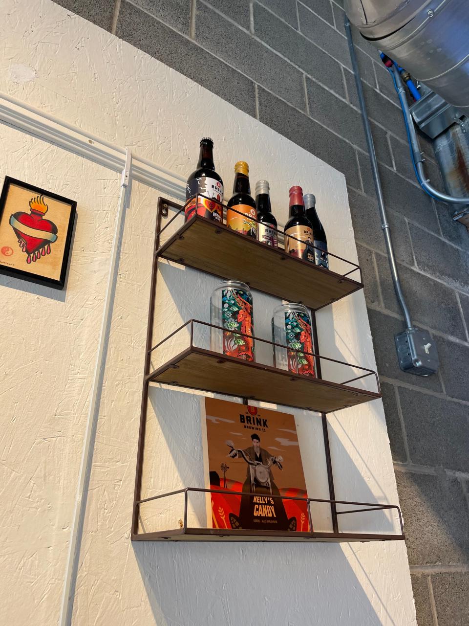 A display of beer labels created by Sawyer Wade at Orr Street Studios
