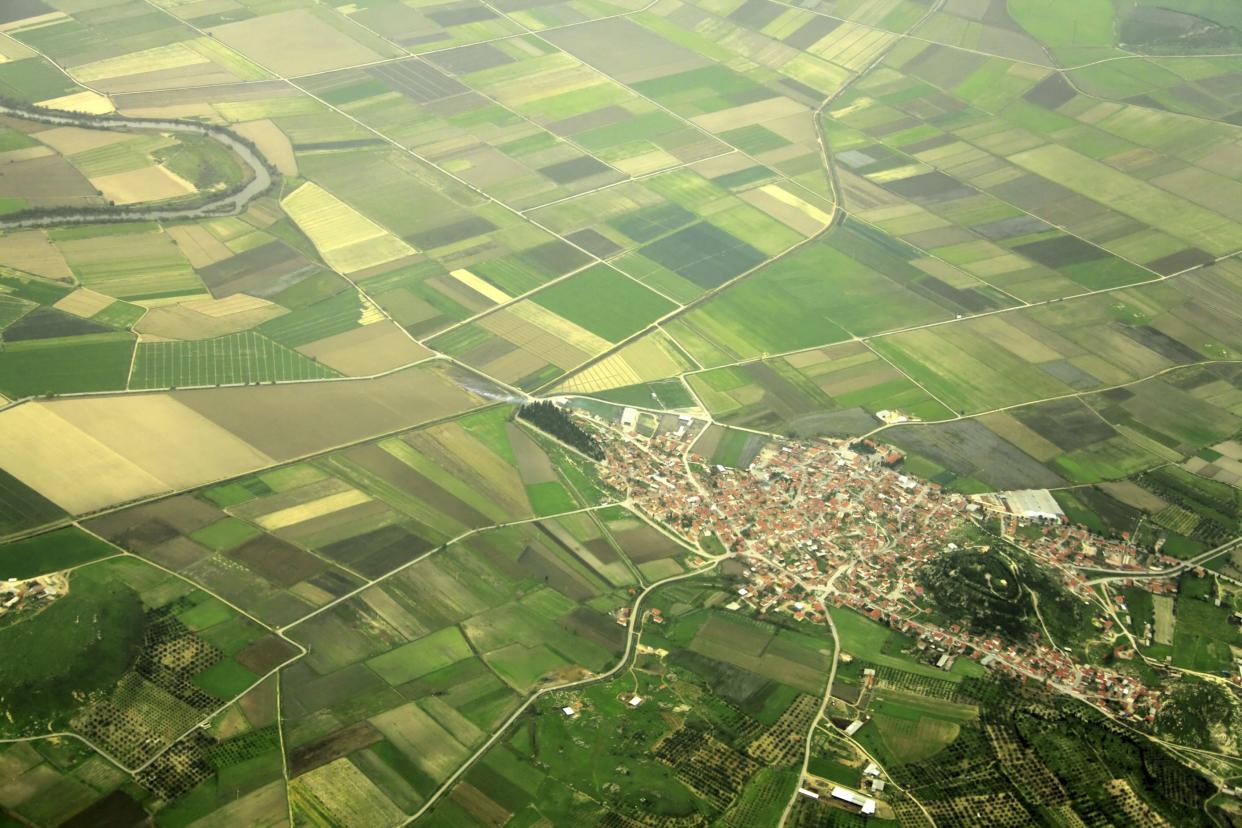 elevated view of farm fields and small town in Izmir, Turkey.
