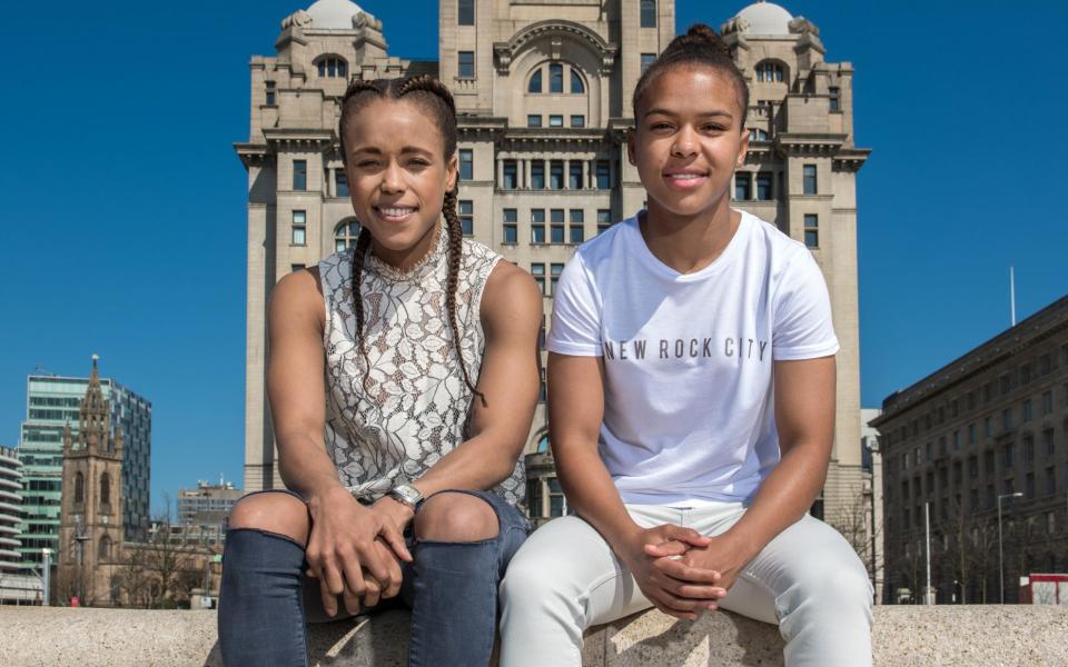 Athlete sisters Natasha Jonas (boxing) and Nikita Parris (football) are pictured at the Liver building in Liverpool.  Photo by Paul Cooper