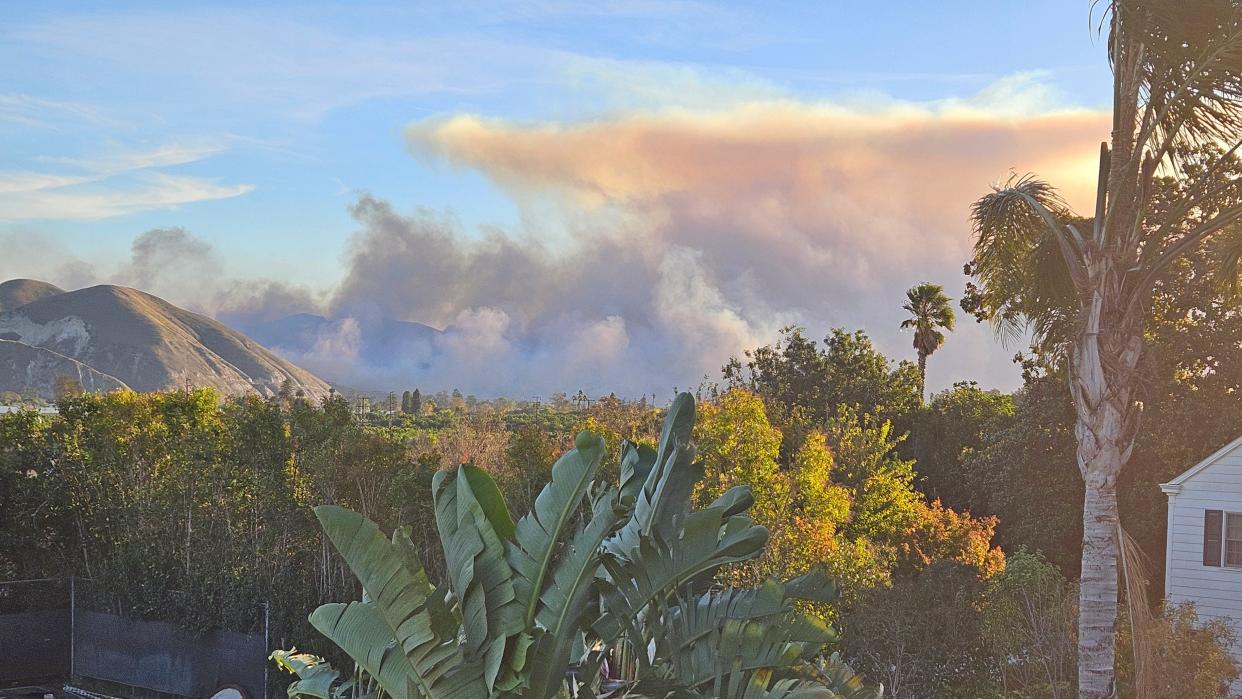 Smoke forms large clouds near South Mountain as a fire raged throughout the day Saturday.