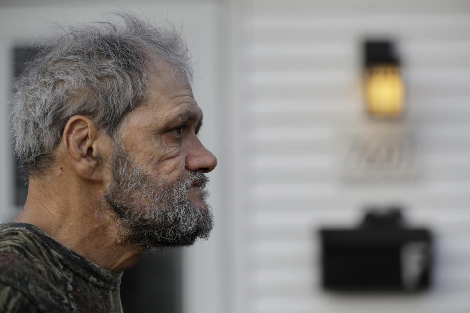 In this Friday, Dec. 20, 2019 photo, Bobby Goldberg looks to the road in front of his home in suburban Chicago. Goldberg has filed a lawsuit claiming he was abused more than 1,000 times in multiple states and countries by the late Donald McGuire, a prominent American Jesuit priest who had close ties to Mother Teresa. (AP Photo/Nam Y. Huh)