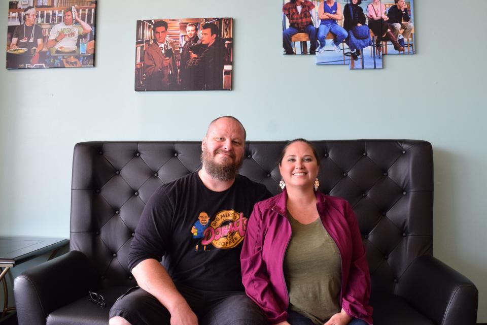 Mike Henry and Andrea Vincent are the owners of Big Mike's Donuts and Coffee. On the walls of the shop, they have hung pictures of some of their favorite movies.