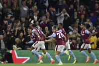 Aston Villa's Jacob Ramsey, left, celebrates after scoring the opening goal during the English Premier League soccer match between Aston Villa and Southampton at Villa Park in Birmingham, England, Friday, Sept. 16, 2022. (AP Photo/Rui Vieira)