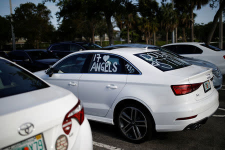 A car with text written on the windows to commemorate the victims of the mass shooting at Marjory Stoneman Douglas High School is parked in Parkland, Florida, U.S., April 5, 2018. REUTERS/Carlos Garcia Rawlins
